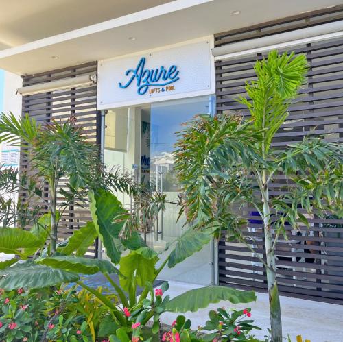 a store front with plants in front of it at Azure Lofts & Pool in San Andrés