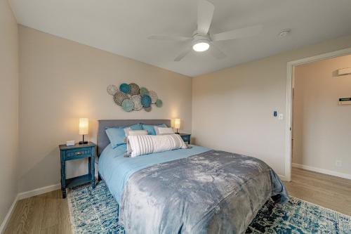 a bedroom with a bed with a blue bedspread at Cozy Home, Close to Ocean and Redwoods in McKinleyville