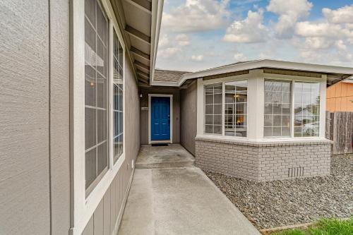 a front door of a house with a blue door at Cozy Home, Close to Ocean and Redwoods in McKinleyville