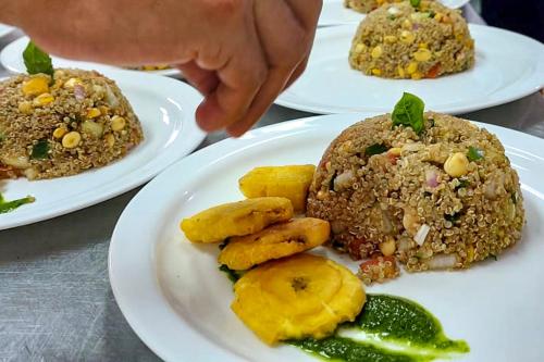 a table with three plates of food on it at Enchanted Galapagos Lodge in Puerto Ayora