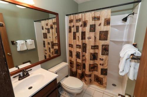 a bathroom with a shower and a toilet and a sink at Seven Springs Swiss Mountain 3 Bedroom Standard Condo, Close to Golf Course condo in Champion