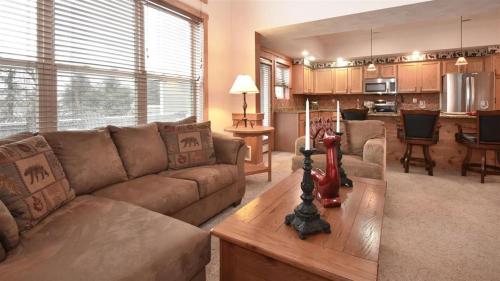 a living room with a couch and a table at Seven Springs Woodridge 3 Bedroom Premium Condo, Sleeps 7! condo in Champion