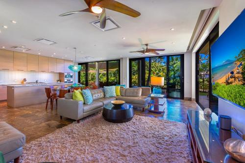 a living room with a couch and a table at Andaz Villa 810 villa in Wailea