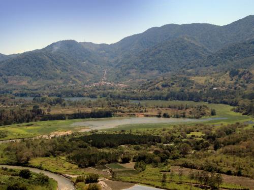 a view of a valley with a river and mountains at Casa Bartzis, Close to Orosi and Tapanti National Park in Orosí