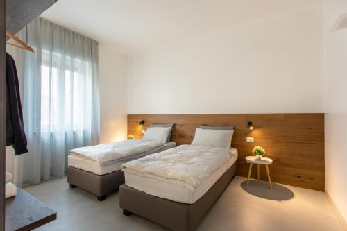 Ένα ή περισσότερα κρεβάτια σε δωμάτιο στο C-Apartments