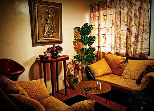 a living room with a couch and a table at One Oasis Condominium in Davao City
