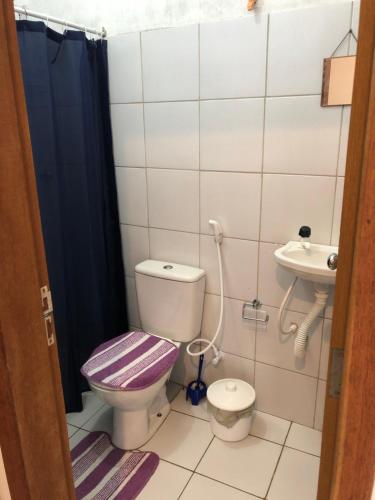 a bathroom with a toilet and a sink at Betesda 2197F in São Luís