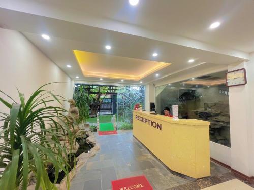 a reception area of a hotel with a reception desk at Rosy Motel Trung Yên in Hanoi