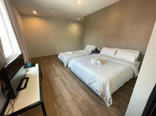 Una cama o camas en una habitación de Chariton Hotel Butterworth