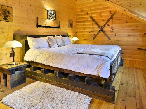 Les Chalets de Môh - 14 chalets indépendantsにあるベッド