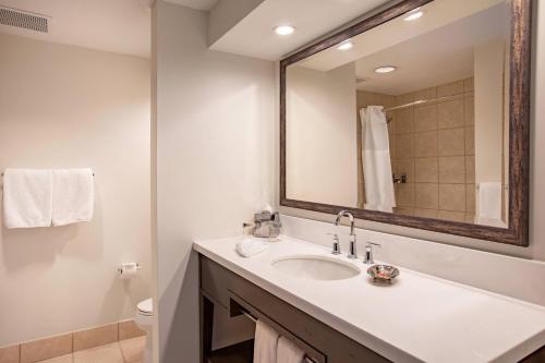 a bathroom with a sink and a mirror at Beaver Creek Lodge, Autograph Collection in Beaver Creek