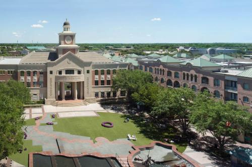 an aerial view of a large building with a clock tower at Houston Marriott Sugar Land in Sugar Land