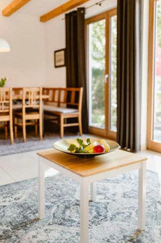 a plate of vegetables on a table in a living room at Seehotel Berau in St. Wolfgang