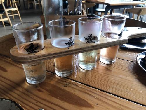 a group of glasses sitting on a wooden table at Daisy House - Whittington - 10 minutes to central Geelong in Whittington