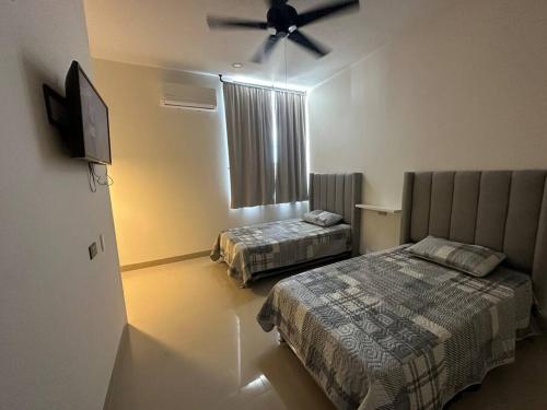 Un pat sau paturi într-o cameră la Departamento isla central 2