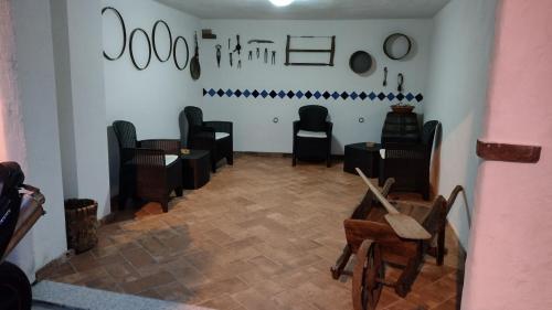 a room with chairs and tables in a room at B&b barbaricino iun F1442 in Oliena