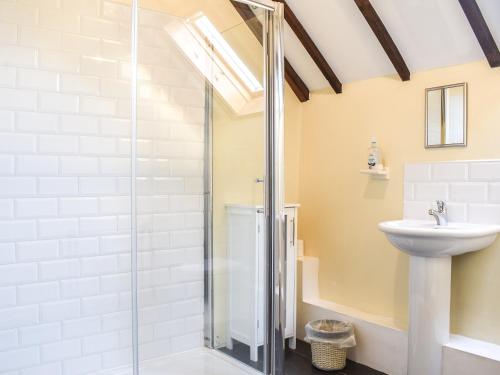 a bathroom with a shower and a sink at Brookside Cottage - Uk42869 in Burntwood