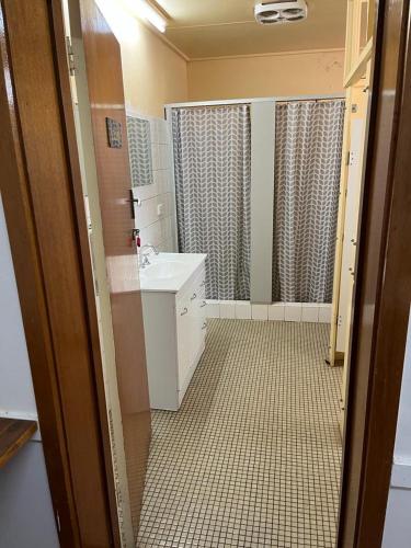 a bathroom with a sink and a shower at Royal Hotel - Accommodation only in Parkes