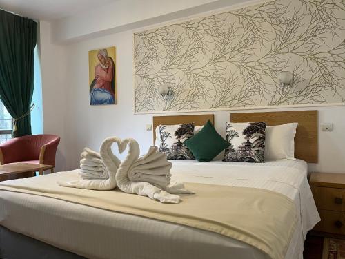 Postel nebo postele na pokoji v ubytování Hotel Michelangelo