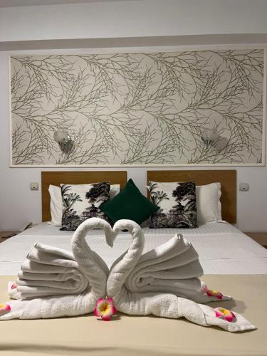 Postel nebo postele na pokoji v ubytování Hotel Michelangelo