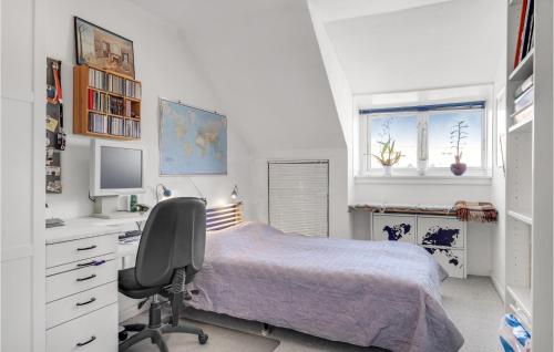 a bedroom with a bed and a desk and a chair at 1 Bedroom Amazing Apartment In Kbenhavn Sv in Copenhagen