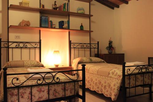 A bed or beds in a room at Il Focolare