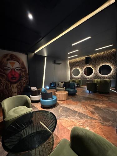 a lobby with couches and chairs and a table at Five Gangtok in Gangtok
