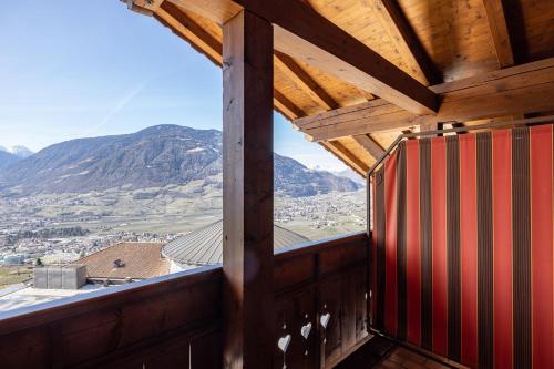 a view from a window of a train car with mountains at Hotel Patriarch in Tirolo