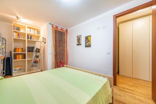 a bedroom with a bed and a book shelf at Casa Ricale in Terra Mala