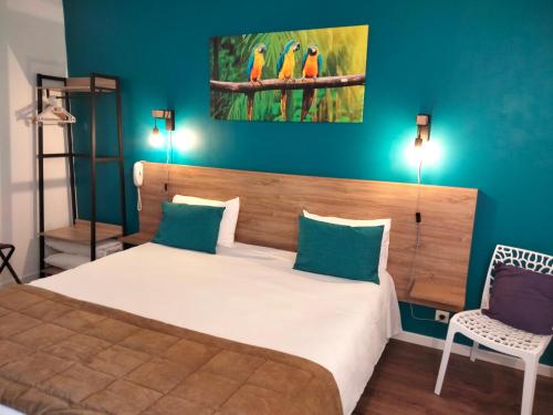 Ένα ή περισσότερα κρεβάτια σε δωμάτιο στο Hotel Au Sans Souci