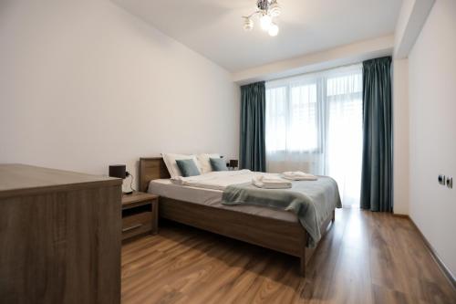 Posteľ alebo postele v izbe v ubytovaní Isaran Apartament with Panoramic City View