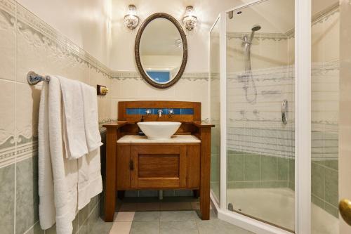 a bathroom with a sink and a shower at Clifton Homestead in Ranelagh