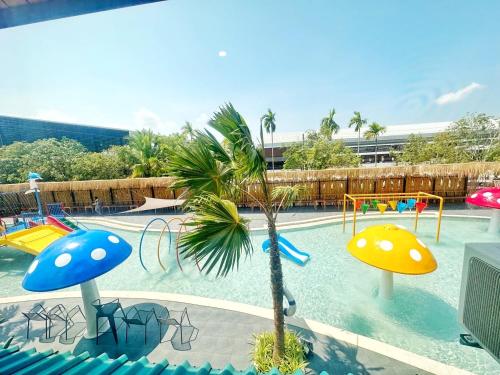 a swimming pool with a water park with a playground at นคร นอน เล่น(Nakhon Norn Len) in Ban Ba Ngan