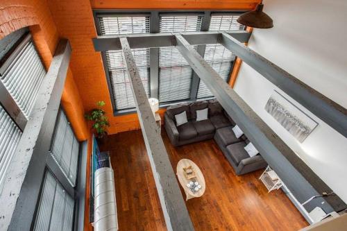 an overhead view of a living room with a couch at Centric Modern Loft w/ King Beds in Rochester