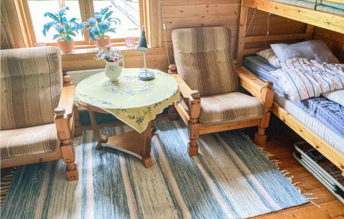 a small table and two chairs in a room at Awesome Home In Lima With Sauna And 2 Bedrooms in Lima