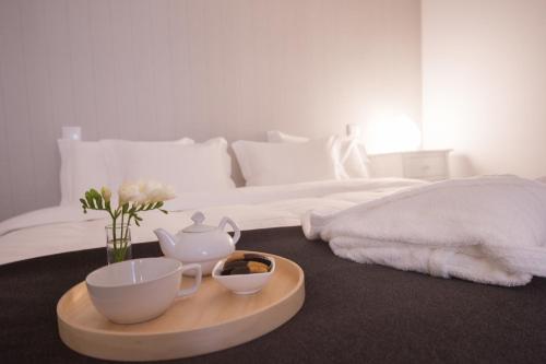Ένα ή περισσότερα κρεβάτια σε δωμάτιο στο Tea 4 Nine Guest House