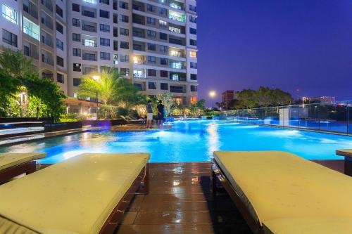 a large swimming pool in a city at night at Everrich Q5 - Two Bedroom in Ho Chi Minh City