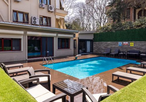 a swimming pool in the middle of a building at BayMari Suites Plus Florya in Istanbul