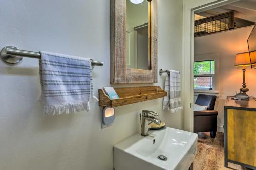a bathroom with a sink and a mirror at Pensacola Studio Bungalow Less Than 1 Mi to Bayview Park! in Pensacola