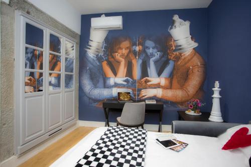 a bedroom with a painting on the wall at Casual Rinascimento Firenze in Florence