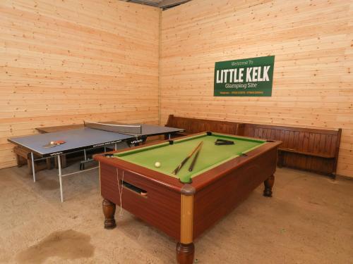 a room with two ping pong tables in it at Covey in Harpham