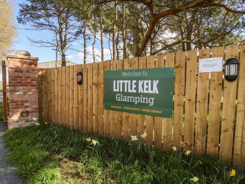 a sign on a fence with a little keesh campaigning at Bouquet in Harpham
