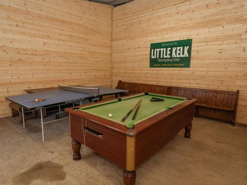 a room with two ping pong tables in it at Mischief in Harpham
