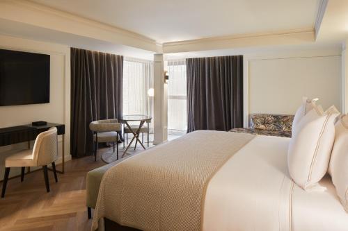 Säng eller sängar i ett rum på Hotel MIM Andorra