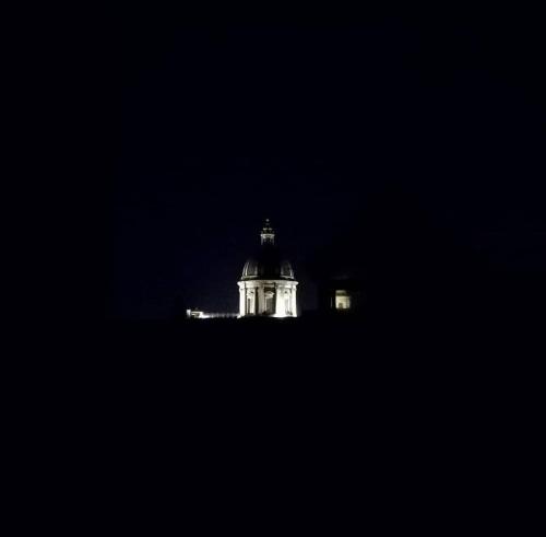 a building lit up at night with at Hotel Biscari in Catania