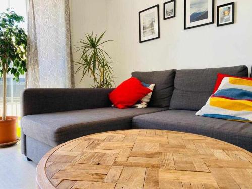 a living room with a couch and a coffee table at Acogedor Apartamento en el Centro de Málaga in Málaga