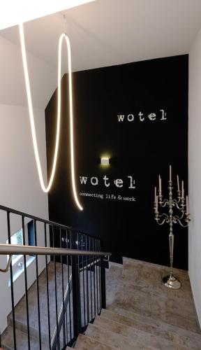 a wall with a sign for the word world on it at Wotel in Söchau