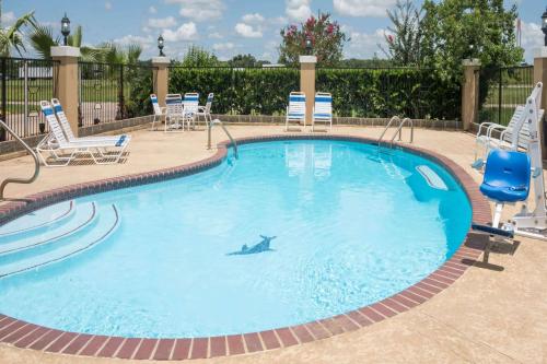 The swimming pool at or close to Super 8 by Wyndham Sealy