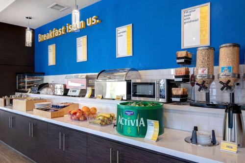 a fast food restaurant with a counter with food at Days Inn & Suites by Wyndham Yorkton in Yorkton