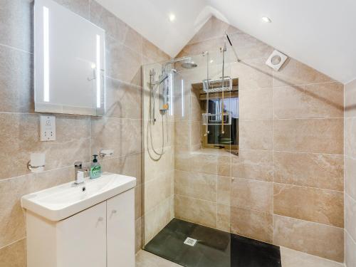 a bathroom with a shower and a sink at Robcross Barn in Airton